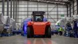 Equipment transporting aircraft engine in hangar