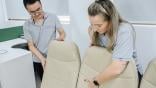 Technicians looking at aircraft seat covers